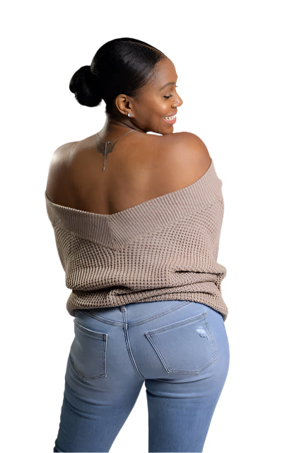 Model wearing a cozy balloon sleeve V-neck waffle sweater in ash mocha, a warm and neutral shade