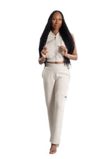 Features cargo-style leg pockets with sleek zipper pulls, made from a durable cotton-polyester blend